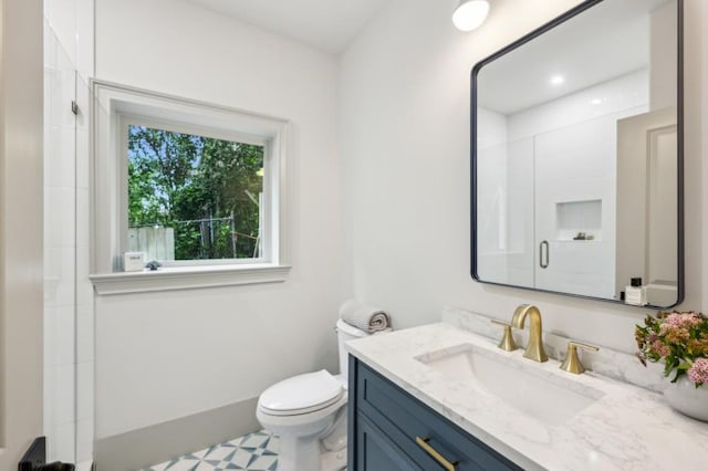 2760 Fraser St SE, Smyrna, GA 30080 - bathroom with vanity, toilet, and a shower with shower door