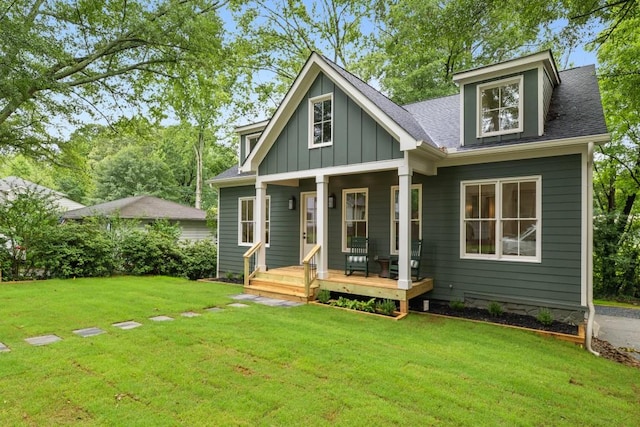 2760 Fraser St SE, Smyrna, GA 30080 - view of front of house featuring a front yard, board and batten siding, covered porch, and roof with shingles