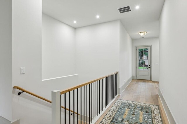 2760 Fraser St SE, Smyrna, GA 30080 - hallway featuring wood finished floors, an upstairs landing, recessed lighting, and baseboards