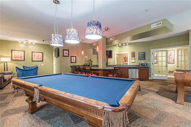 game room with carpet, french doors, indoor bar, and pool table