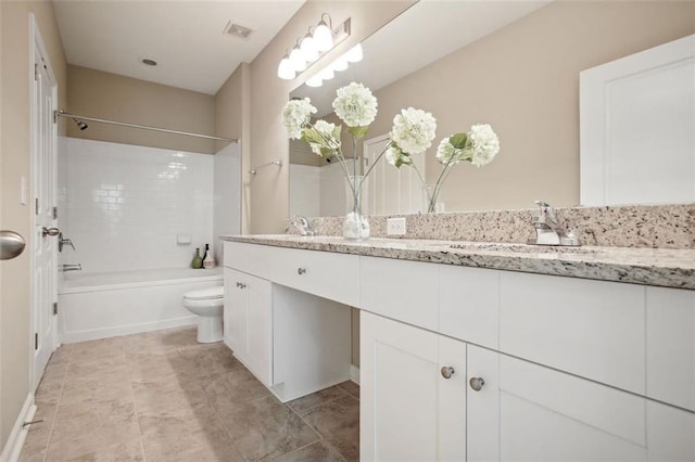 full bathroom featuring vanity, toilet, and tiled shower / bath