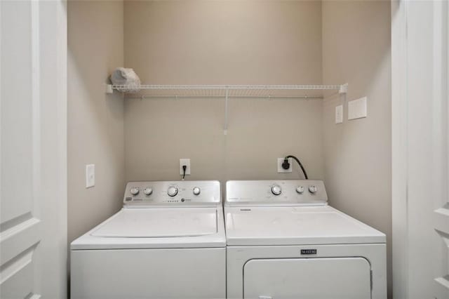 laundry room with independent washer and dryer