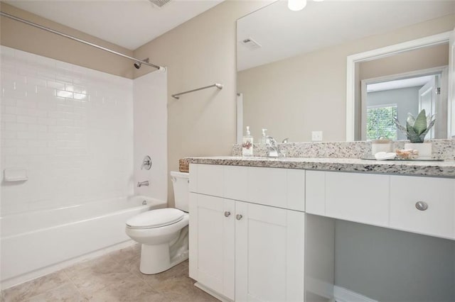 full bathroom featuring tile patterned flooring, toilet, vanity, and washtub / shower combination