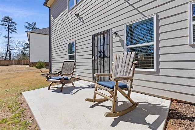 view of patio featuring fence