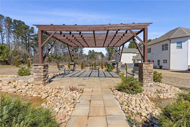 view of home's community featuring a patio and a pergola