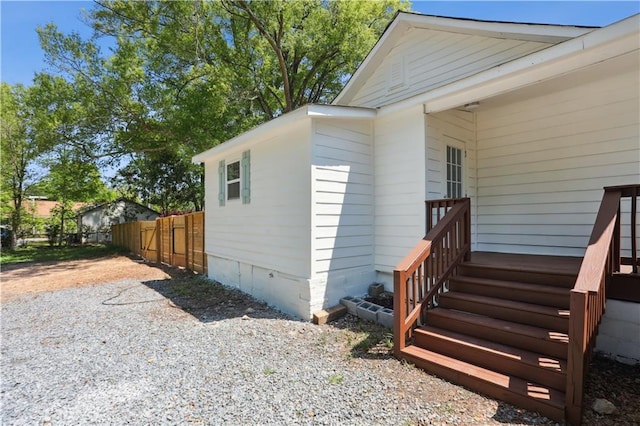 view of side of property with fence