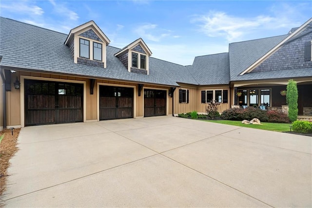 49 Waterside Dr SE, Cartersville, GA 30121 - view of front facade with an attached garage, concrete driveway, and board and batten siding