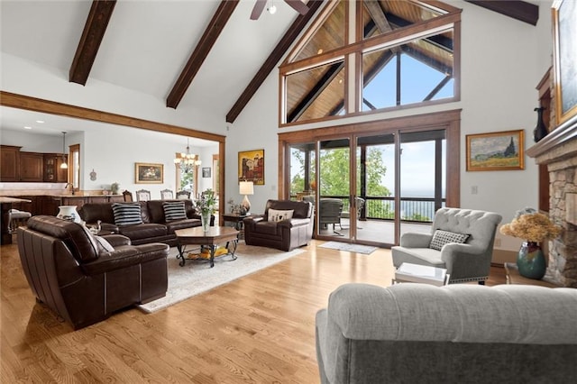 49 Waterside Dr SE, Cartersville, GA 30121 - living room featuring high vaulted ceiling, a chandelier, beamed ceiling, light wood finished floors, and a ceiling fan