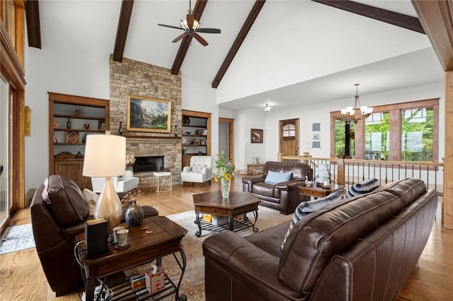49 Waterside Dr SE, Cartersville, GA 30121 - living area with ceiling fan, a chandelier, a fireplace, wood finished floors, and high vaulted ceiling