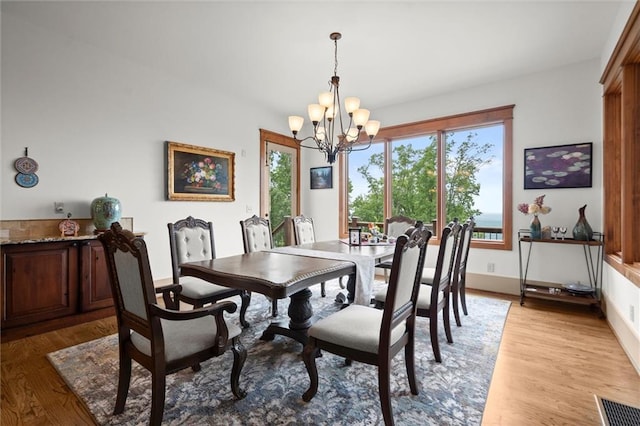 49 Waterside Dr SE, Cartersville, GA 30121 - dining space featuring a chandelier and light wood-style floors