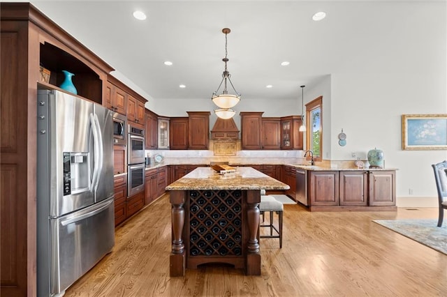 49 Waterside Dr SE, Cartersville, GA 30121 - kitchen featuring appliances with stainless steel finishes, a breakfast bar, glass insert cabinets, recessed lighting, and a center island