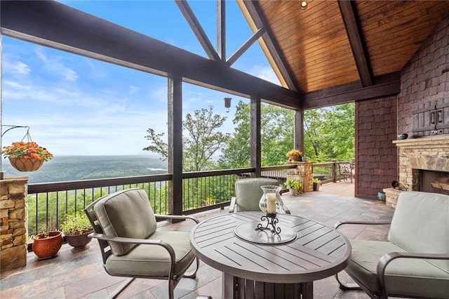 49 Waterside Dr SE, Cartersville, GA 30121 - sunroom with an outdoor stone fireplace