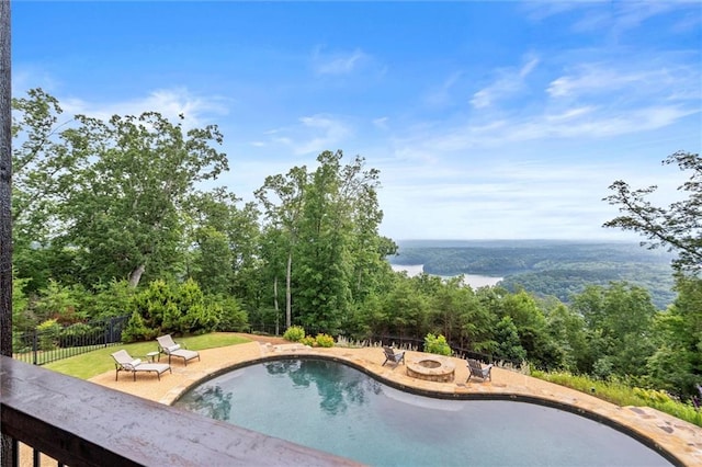 49 Waterside Dr SE, Cartersville, GA 30121 - view of swimming pool with an outdoor fire pit, a patio area, and a wooded view
