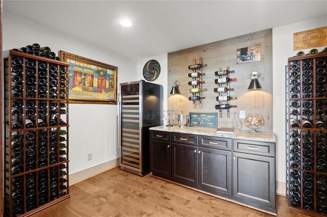 49 Waterside Dr SE, Cartersville, GA 30121 - wine area featuring light wood-style floors, recessed lighting, and a bar
