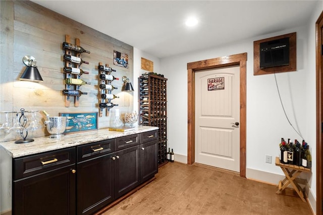 49 Waterside Dr SE, Cartersville, GA 30121 - wine area featuring light wood finished floors and bar area