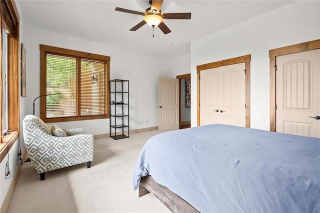 49 Waterside Dr SE, Cartersville, GA 30121 - bedroom with light colored carpet, ceiling fan, and two closets