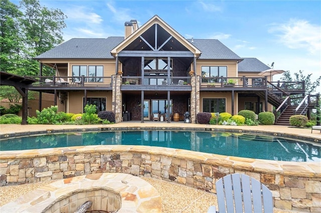 49 Waterside Dr SE, Cartersville, GA 30121 - back of house featuring stairway, a chimney, an outdoor pool, and a deck