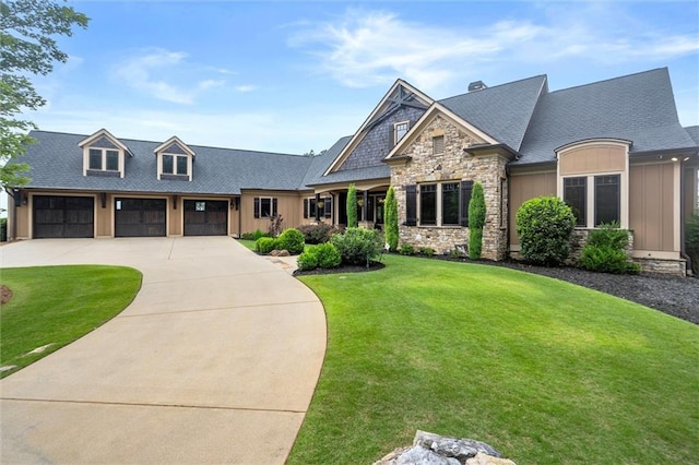 49 Waterside Dr SE, Cartersville, GA 30121 - view of front facade featuring board and batten siding, stone siding, a front lawn, driveway, and roof with shingles