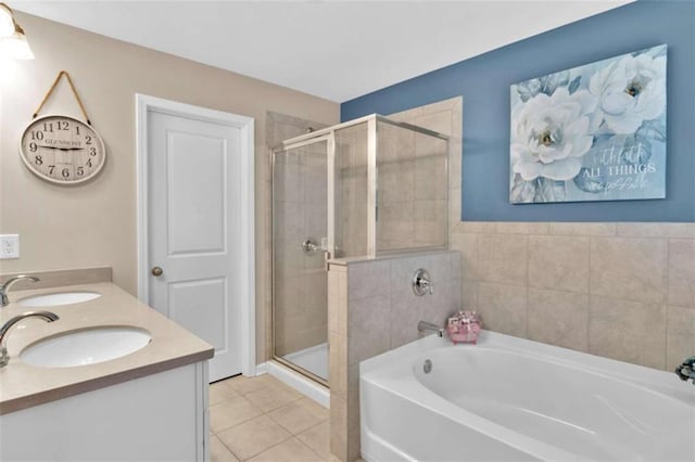 bathroom featuring vanity, shower with separate bathtub, and tile patterned flooring