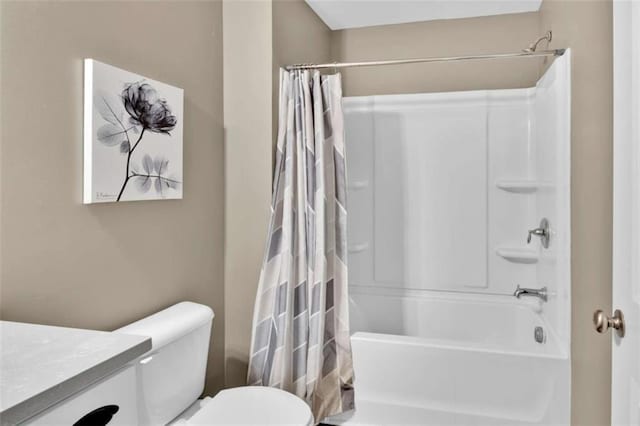 full bathroom featuring toilet, vanity, and shower / bathtub combination with curtain