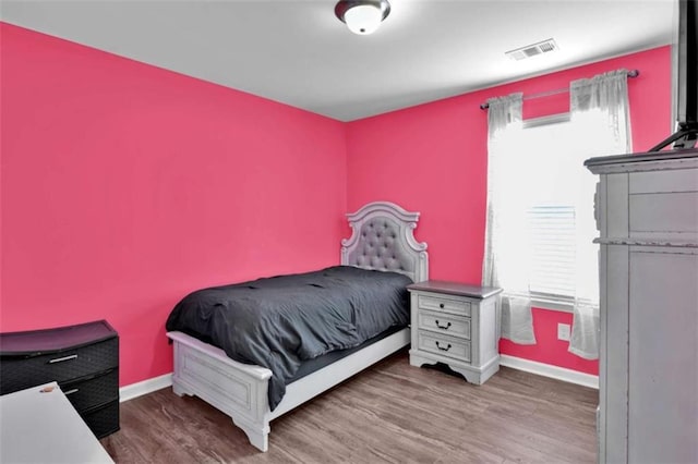 bedroom featuring hardwood / wood-style floors