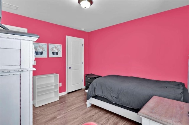 bedroom featuring hardwood / wood-style flooring