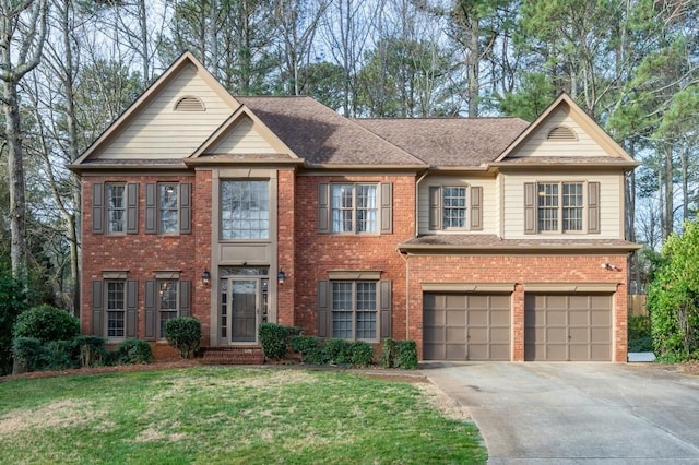 view of front facade featuring brick siding, driveway, a front lawn, and a garage