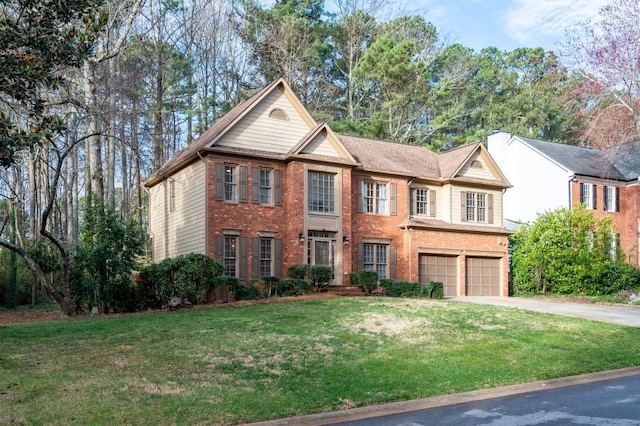 view of front of property with brick siding, driveway, an attached garage, and a front lawn