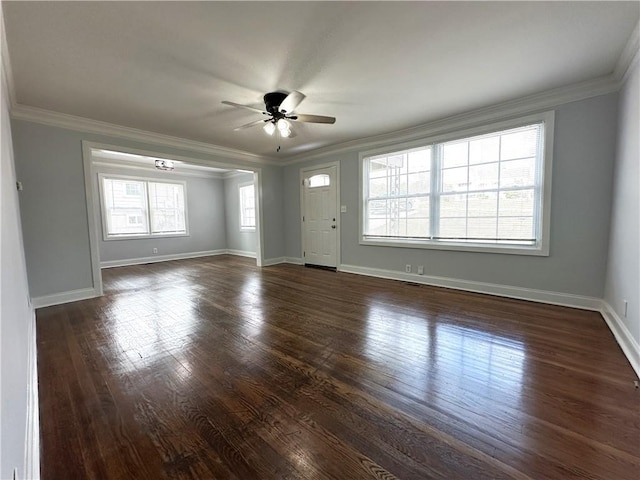 interior space featuring ornamental molding, dark wood-style flooring, a ceiling fan, and baseboards