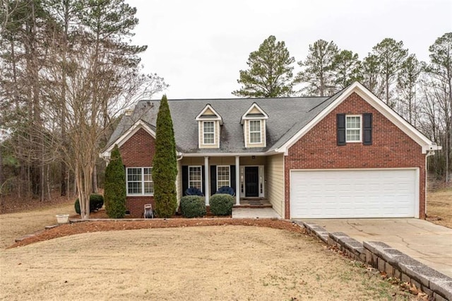 view of front of home featuring a porch and a garage