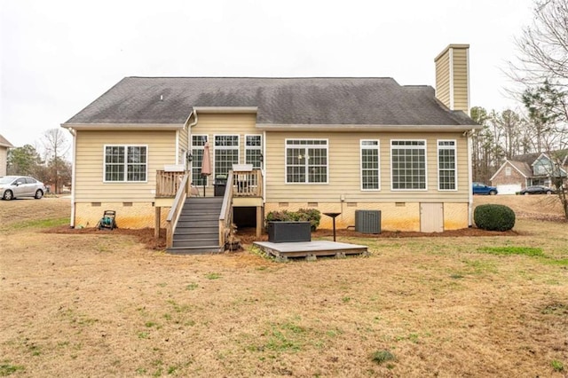 back of house featuring a lawn, cooling unit, and a deck