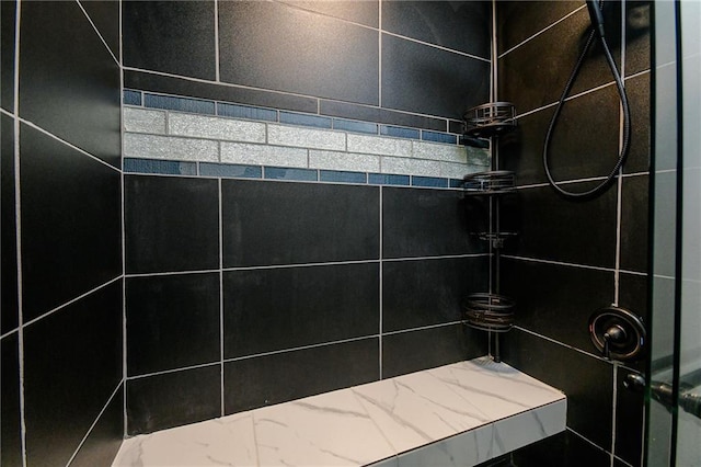 details featuring tiled shower