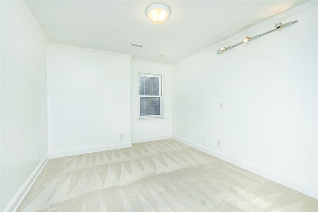 unfurnished room with light carpet