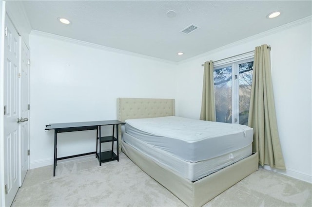 bedroom featuring ornamental molding and light colored carpet