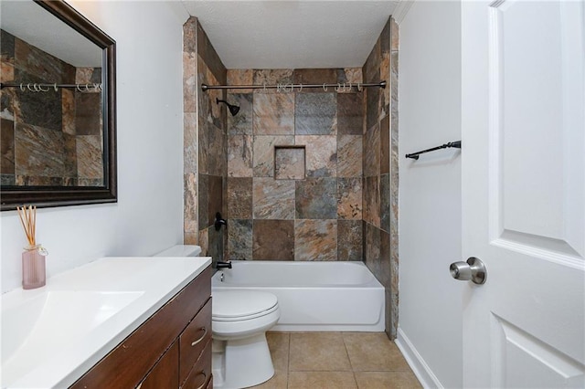 full bathroom featuring tiled shower / bath combo, vanity, tile patterned floors, and toilet