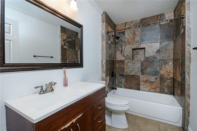 full bathroom with vanity, ornamental molding, a textured ceiling, toilet, and tiled shower / bath