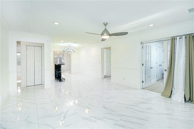 unfurnished room with ceiling fan and ornamental molding