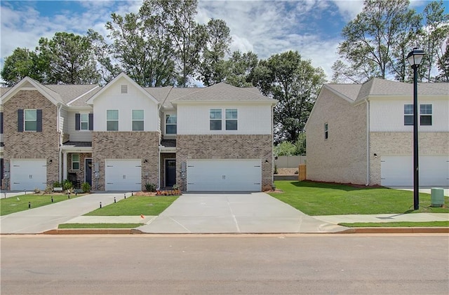 view of front of home featuring a garage and a front lawn