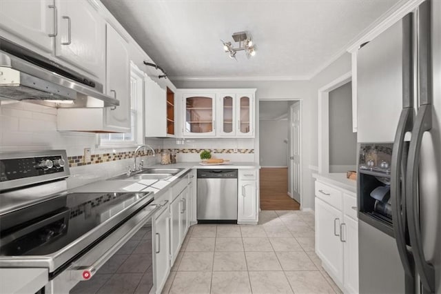 kitchen featuring crown molding, white cabinetry, sink, and appliances with stainless steel finishes