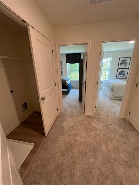 1569 Aiden Way Unit 35, Conyers, GA 30013 - hallway featuring light colored carpet and baseboards