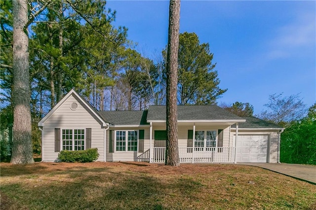 ranch-style home with a garage and a front yard