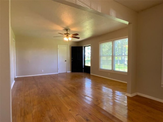 995 Gadsden Rd, Cave Spring, GA 30124 - spare room featuring hardwood / wood-style flooring, baseboards, and a ceiling fan