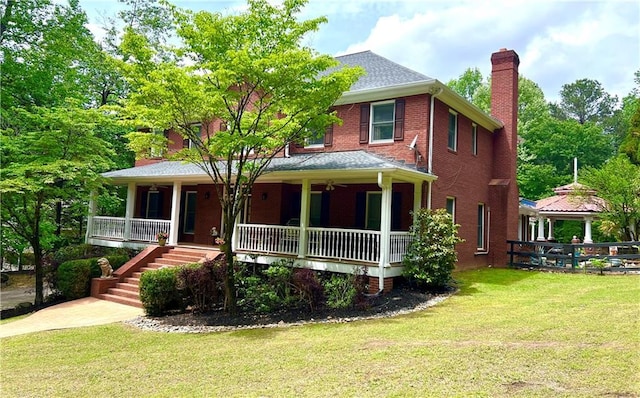 2230 Cammie Wages Rd, Dacula, GA 30019 - view of front of house featuring a porch, a chimney, a front lawn, brick siding, and stairway