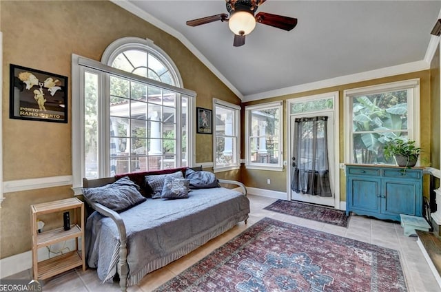 bedroom with crown molding, ceiling fan, baseboards, light tile patterned flooring, and vaulted ceiling