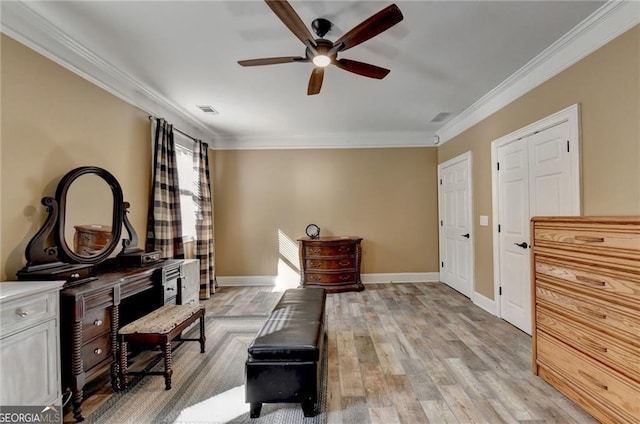 sitting room featuring ceiling fan, crown molding, visible vents, and light wood-style floors