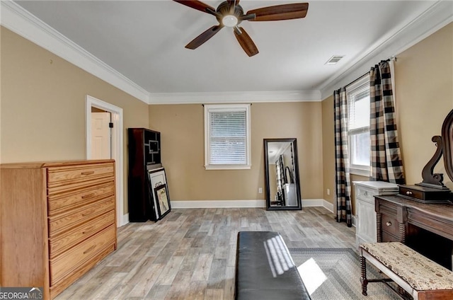 workout room featuring a wealth of natural light, crown molding, and a ceiling fan