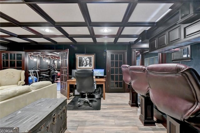 home office featuring coffered ceiling, french doors, and light wood-style floors