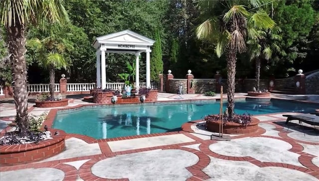 view of swimming pool with a fenced in pool, a patio area, and fence