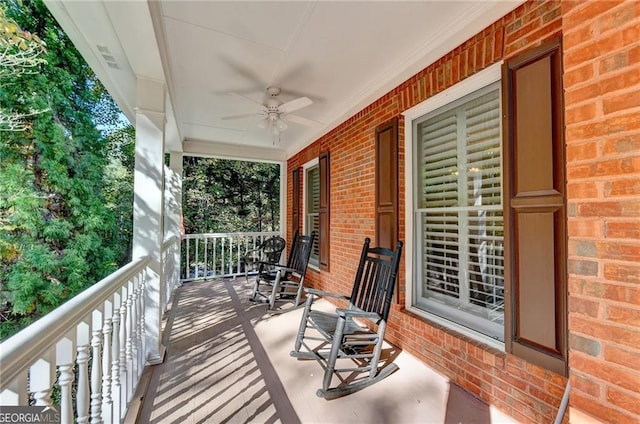 deck featuring a ceiling fan and covered porch