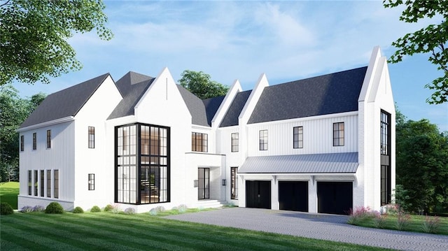 modern farmhouse featuring an attached garage, driveway, a chimney, and a front lawn